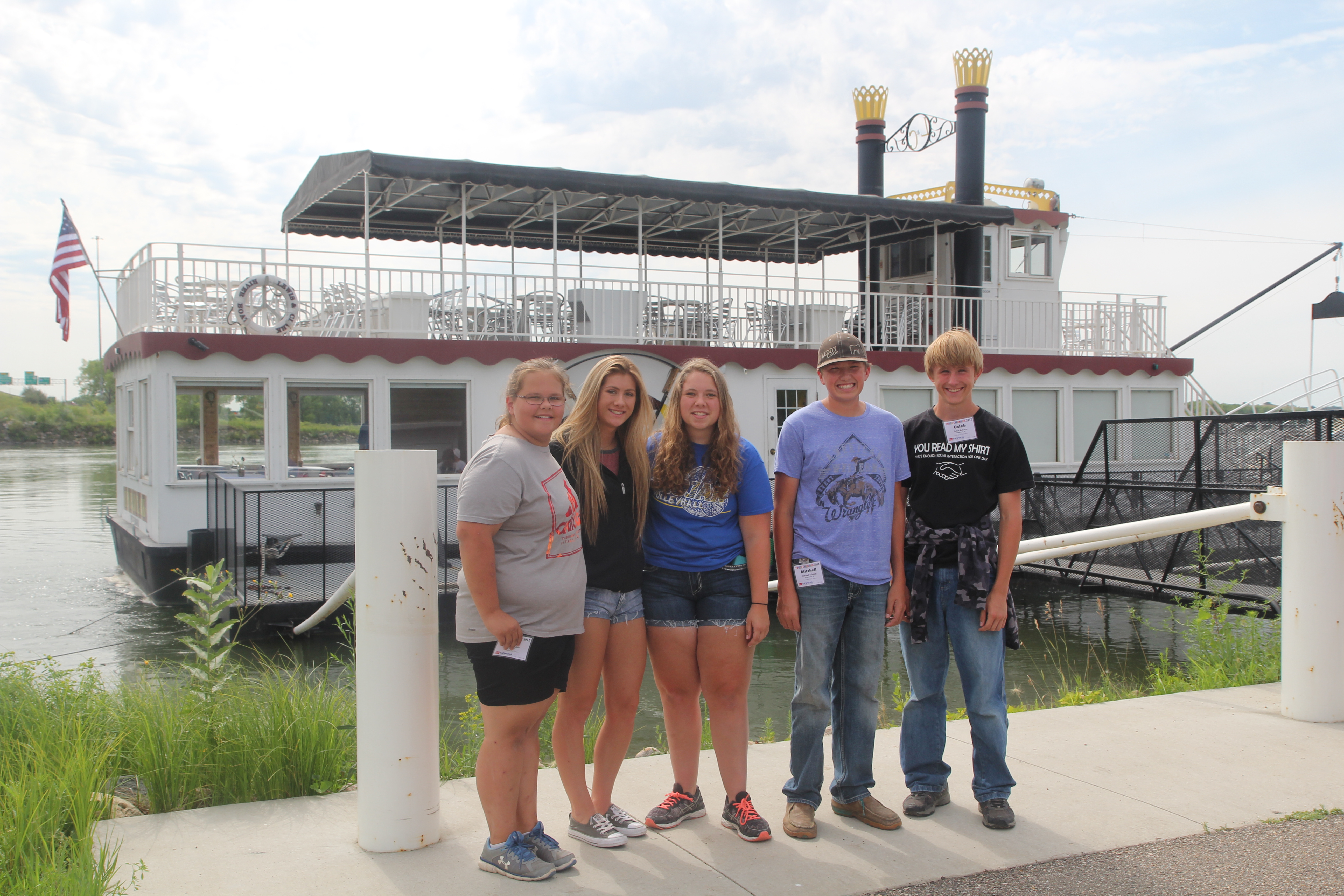 Youth on the Excursion in front of the tour boat