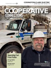 Lineworker with hardhat in front of truck